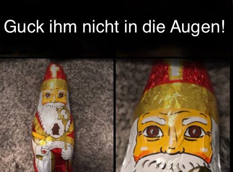 Das Bild zeigt einen Schokoladen-Nikolaus in seiner Verpackung, mit einem Detailbild des Kopfes, auf dem die Augen sehr groß dargestellt sind. Der Text im Bild lautet: "Guck ihm nicht in die Augen!"