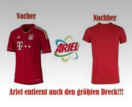 Das Bild zeigt ein "Vorher-Nachher"-Vergleich mit zwei roten T-Shirts. Links ist ein Fußballtrikot mit Logo, rechts ein schlichtes rotes T-Shirt. In der Mitte ist das Logo von Ariel. Der Text unter den Bildern sagt: "Ariel entfernt auch den größten Dreck!!!"